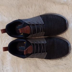 Dark gray, almost black slip on Skechers